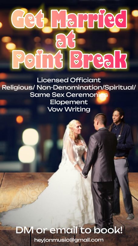 Couple in wedding attire with bokeh lights in the background, promoting wedding services.